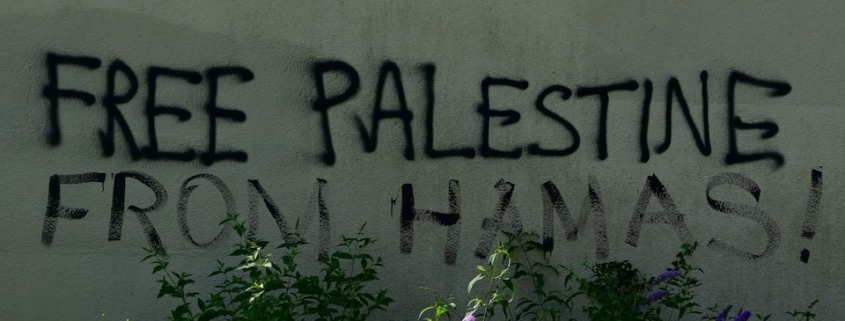 A sign that says free palestine written on the side of a building